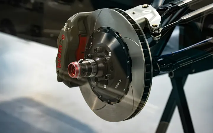 Close-up of a car brake disc and caliper during a repair