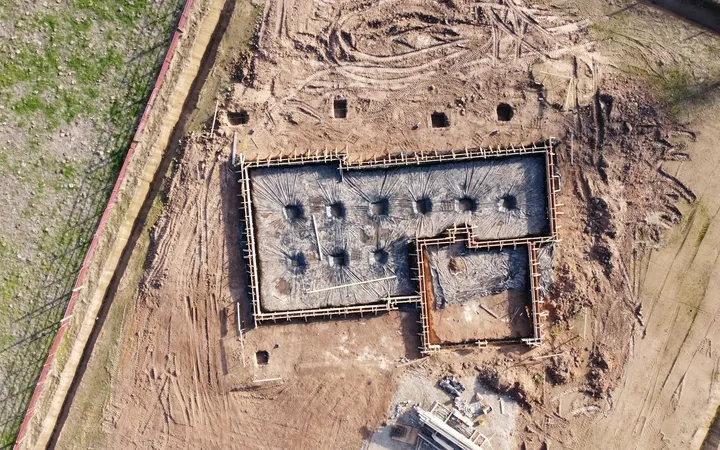 Aerial view of a new concrete house foundation